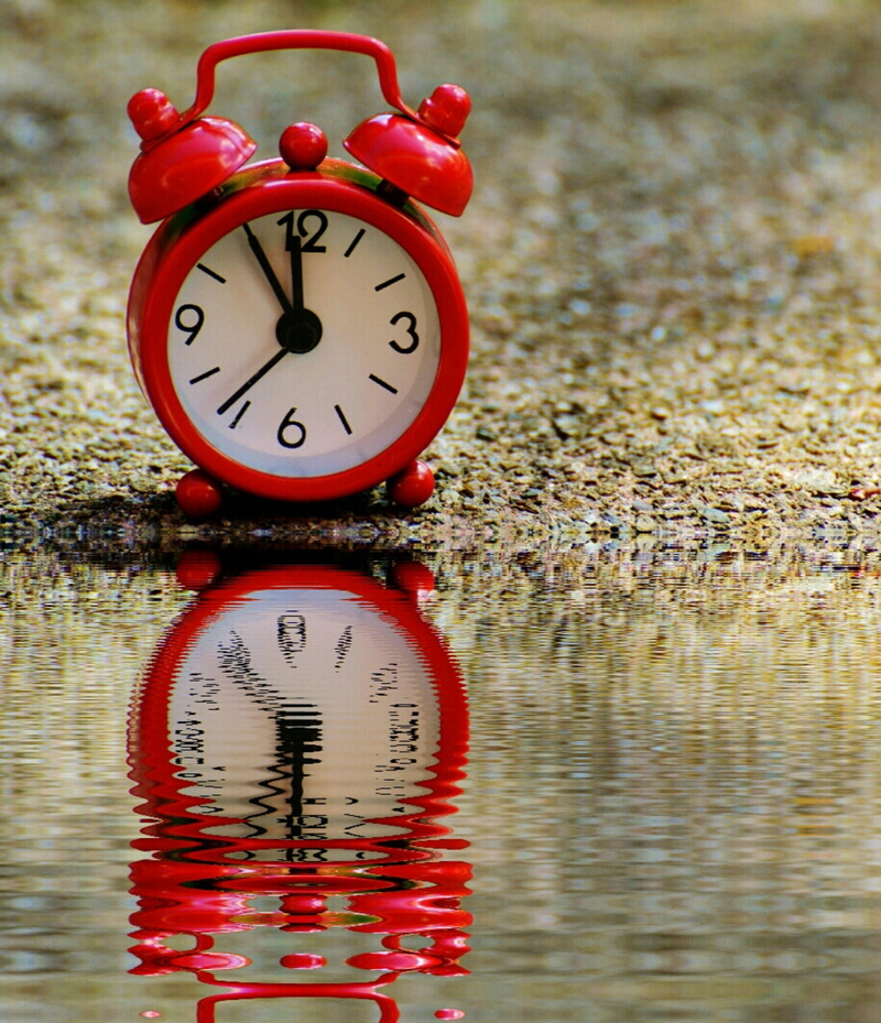 instrument of time, geometric shape, bell, dial, hour hand, time indicating, the eleventh hour, bank, waterfront, alarm clock, reflection, alarm, ring the bell