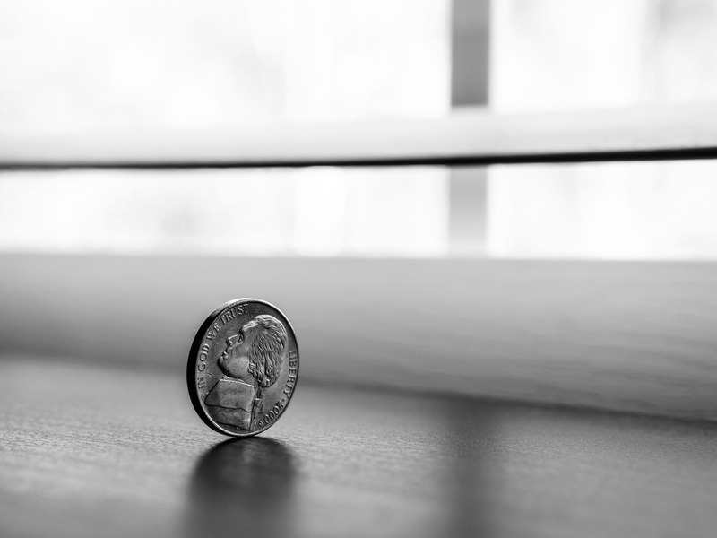 carvings, table, royalty  images, single object, text, black-and-white, round, geometric shape, focus on foreground, depth of field, business, currency