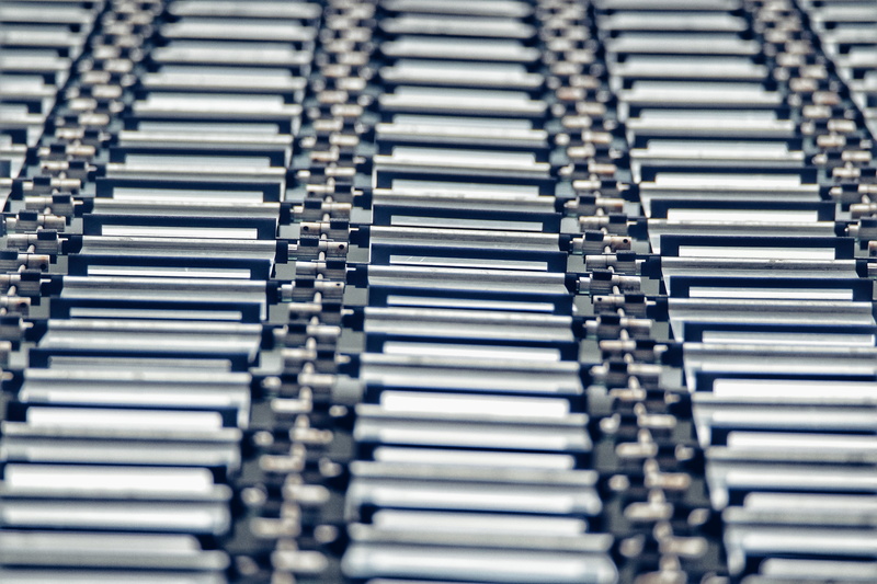 studio shot, industry, large group of objects, zipper, no people, cpu, pattern, silver colored, gray, arts culture and entertainment, selective focus, electronic chip