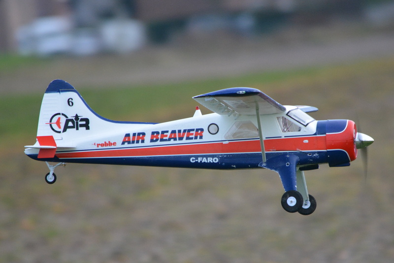 airplane, air, motion, focus on foreground, close-up, day, transportation, single object, model airplane, propeller, mode of transportation, outdoors, 4K