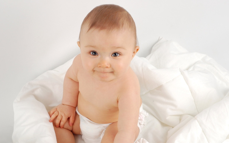 smiling, emotion, smily, tight, Baby, child, childhood, smile, lipped, lying down, looking at camera, happiness, 2K, front view, furniture, diaper, bed
