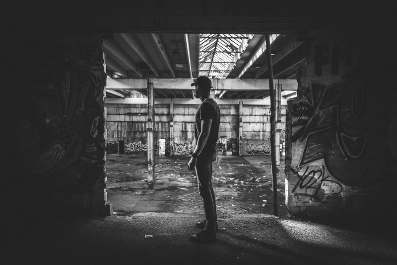 graffiti, brick, leisure activity, wall, back, one person, full length, lifestyles, floor, corridor, rear view, abandoned, walking, exercise, window, built structure