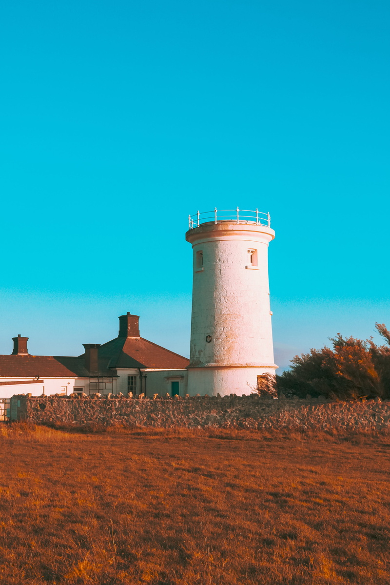 stone, lighthouse, protection, orange, nature, colourful, trees, building, architecture, no people, land, day, bushes, clear sky, white, human, plant, outdoors