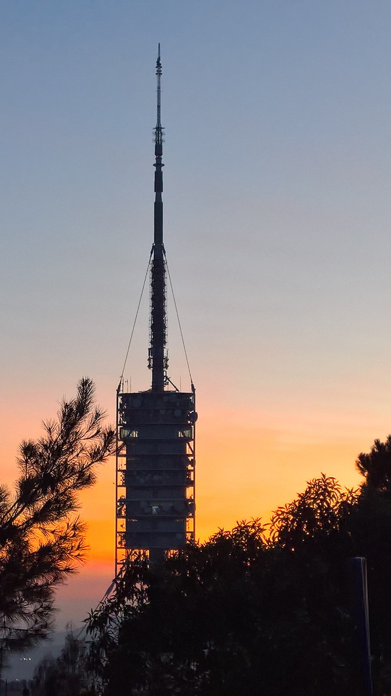spire, silhouette, office building exterior, city, telecom, sky, spain, no people, nature, clear sky, built structure, sunset, tall - high, collserola