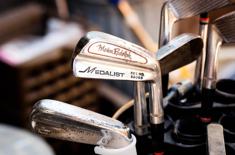 land vehicle, gray, outdoors, 2K, sign, day, number, set, game, metal, golf club, architecture, western script, club, communication, iron, mode of transportation