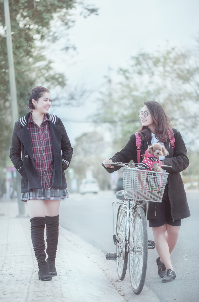 front view, teenager, females, clothing, seductive, graceful, bicycle, tip leads, nice, smiling, vietnam, the landscape, real people, nice picture, transportation