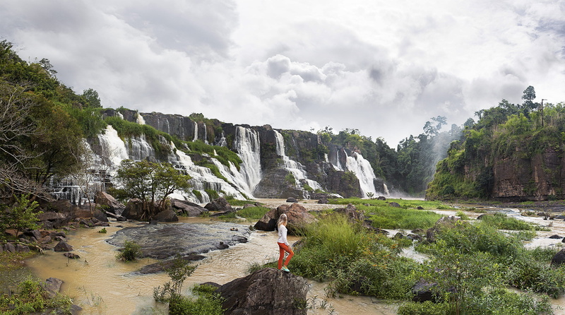 women, beauty in nature, trees, adult, outdoors, power in nature, leisure activity, rock, solid, nature, dalat, environment, people, sky, waterfall, clouds