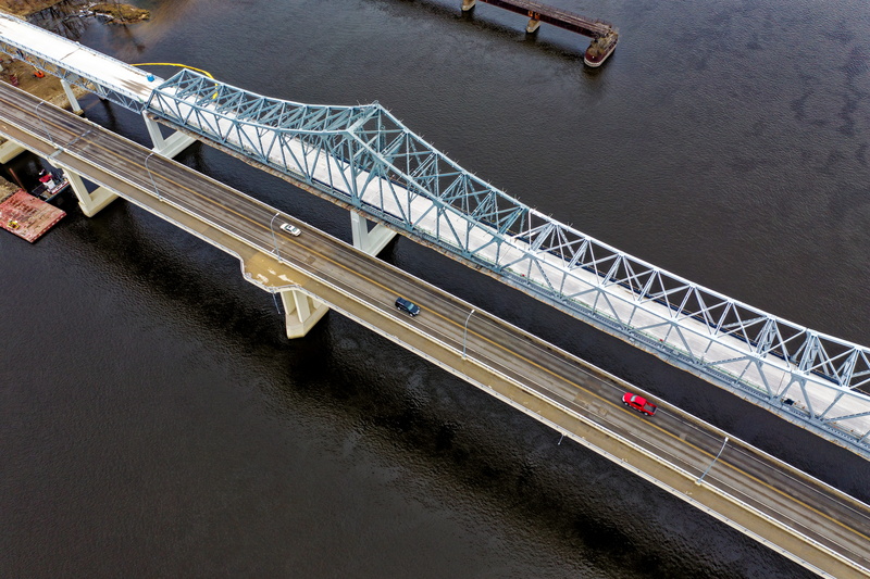 architecture, outdoors, 5K, high angle view, road, aerial, Mississippi River, drone shot, birds eye view, incidental people, day, railing, water, shot