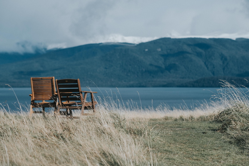 cloud - sky, tranquil scene, furniture, new zealand, grass, hut, wooden, shelter, rural, day, mountain range, 5K, field, nature, beauty in nature, outdoors