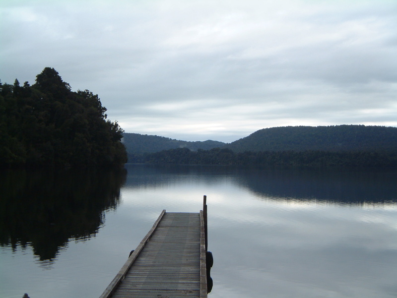 tranquil scene, sky, reflection, day, outdoors, wood - material, direction, tree, south, nz, water, beauty in nature, jetty, south island, scenics - nature