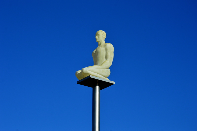 sunny, single object, clear sky, blue background, sky, male likeness, 5K, low angle view, success, metal, human representation, outdoors, place masséna