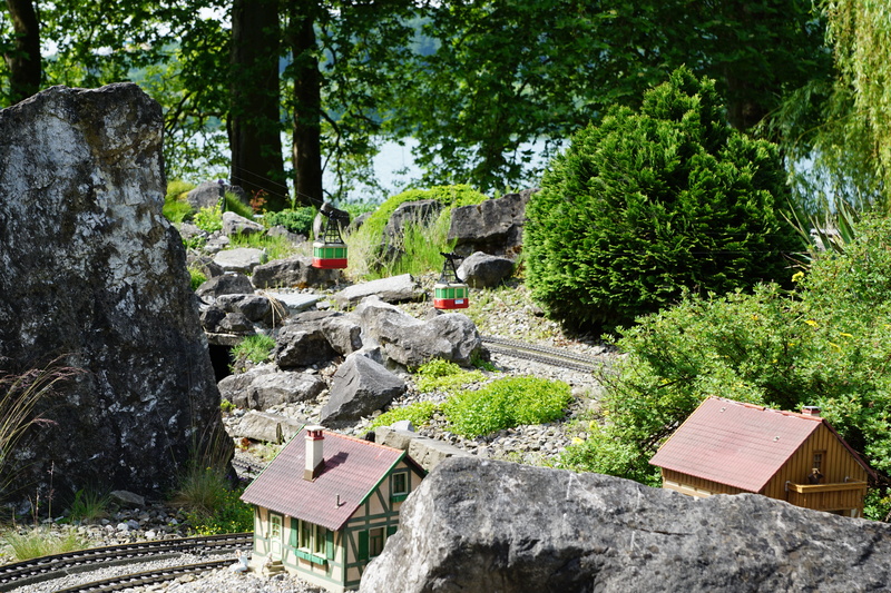 train, water, bridge, solid, miniature, growth, park, built structure, nature, railway, tree, seemed, architecture, tranquility, no people, mainau, outdoors