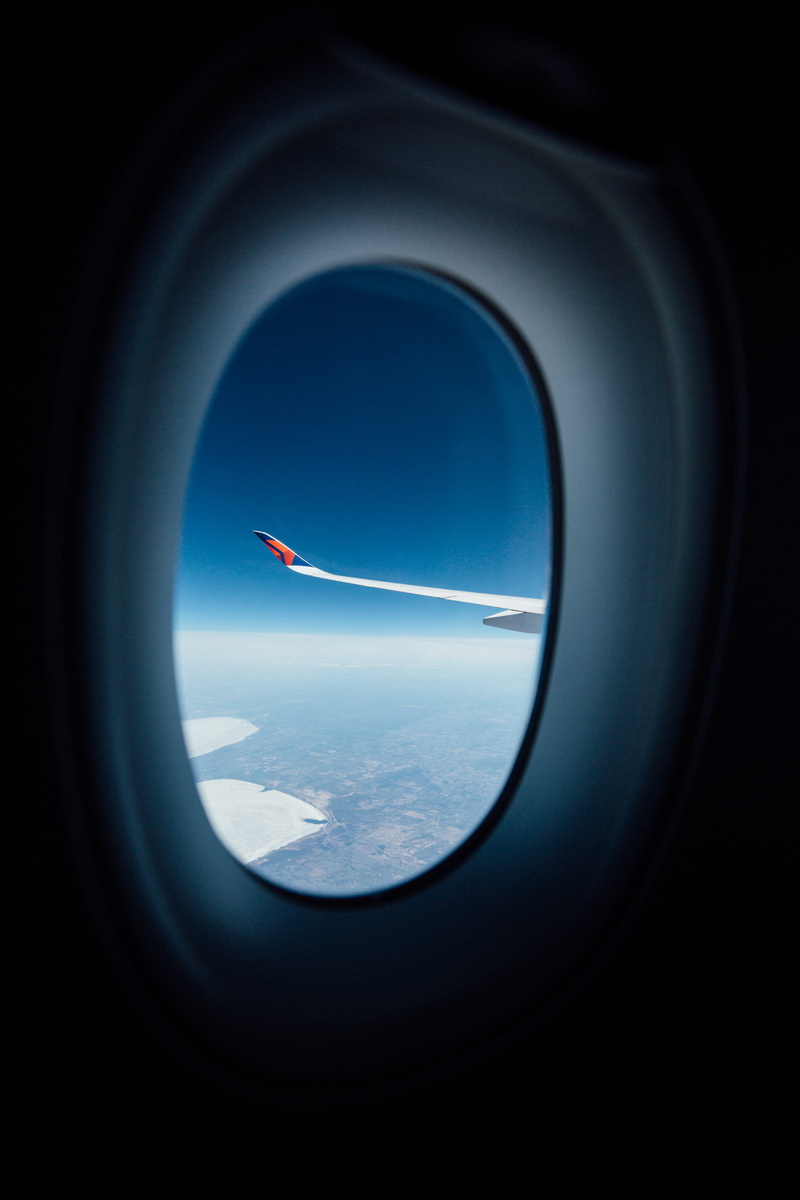 glass - material, lens - optical instrument, nature, commercial airplane, king snake, paint container, coil, reptile, air vehicle, sea life, spiral, mid-air