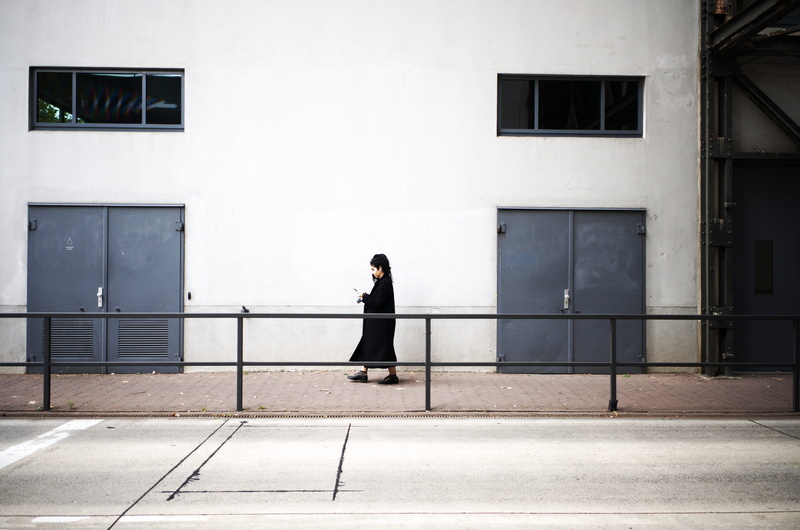 urbanphotography, daytime, banister, wall, sleeve, street, white, hairstyle, one person, flooring, pathway, shoe, day, streetphotography, person, apparel