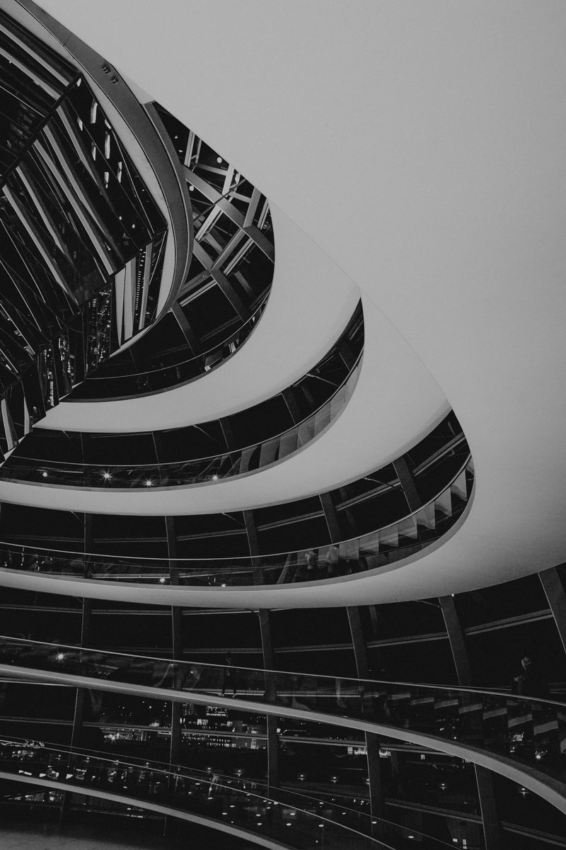 skylight, machine, outdoors, banister, coil, spiral, building, city, built structure, day, office building exterior, modern, asphalt, fractal, no people