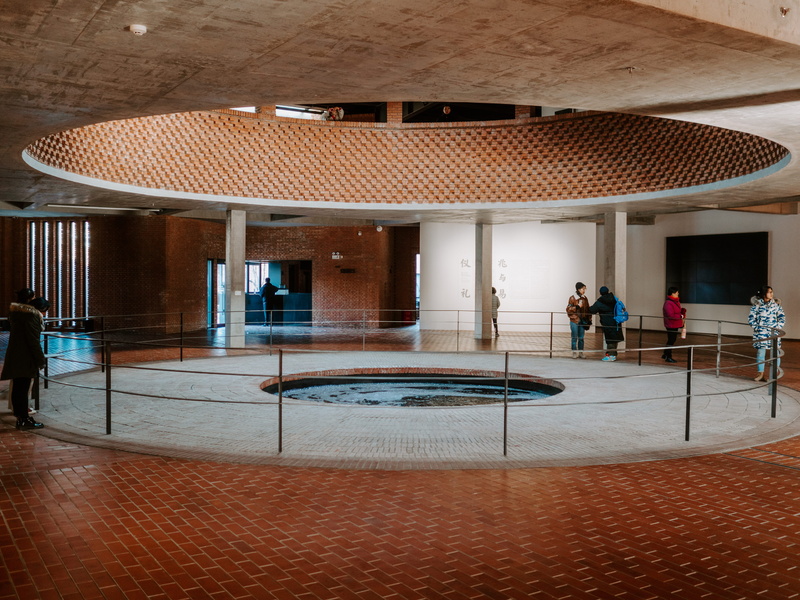 office building, tiled floor, architectural column, inside, group of people, building, plywood, full length, wood, women, concrete, interior design, built structure