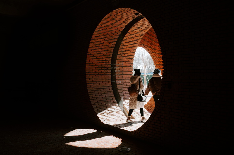 real people, dungeon, human, manhole, black, white, path, corridor, light, black background, crystal, 5K, tunnel, men, architecture, walkway, arch, geometric shape