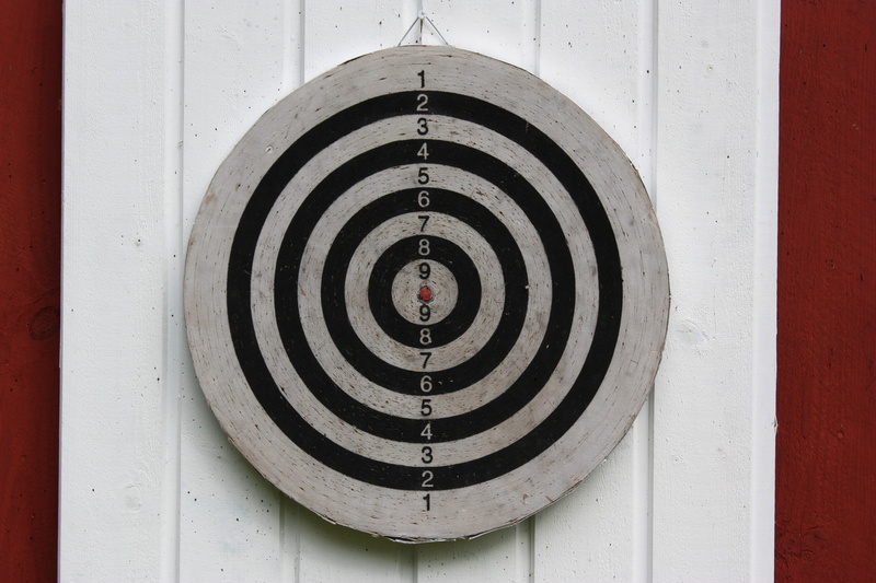 target shooting, built structure, circle, shape, accuracy, single object, white color, sport, architecture, garden, sports target, security, wall - building feature
