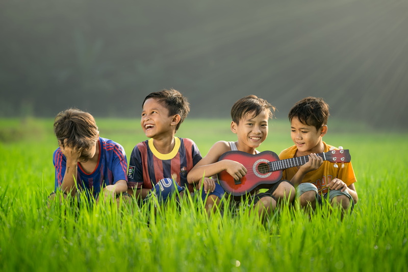 happiness, plant, plucking an instrument, daytime, boy, friendship, green, music, child, fun, string instrument, women, men, positive emotion, happy, nature