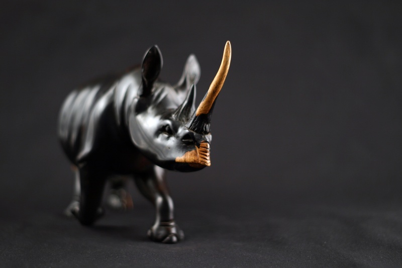 colored background, toy, representation, horned, one animal, indoors, 2K, aggression, wood, gray background, animal wildlife, full length, single object