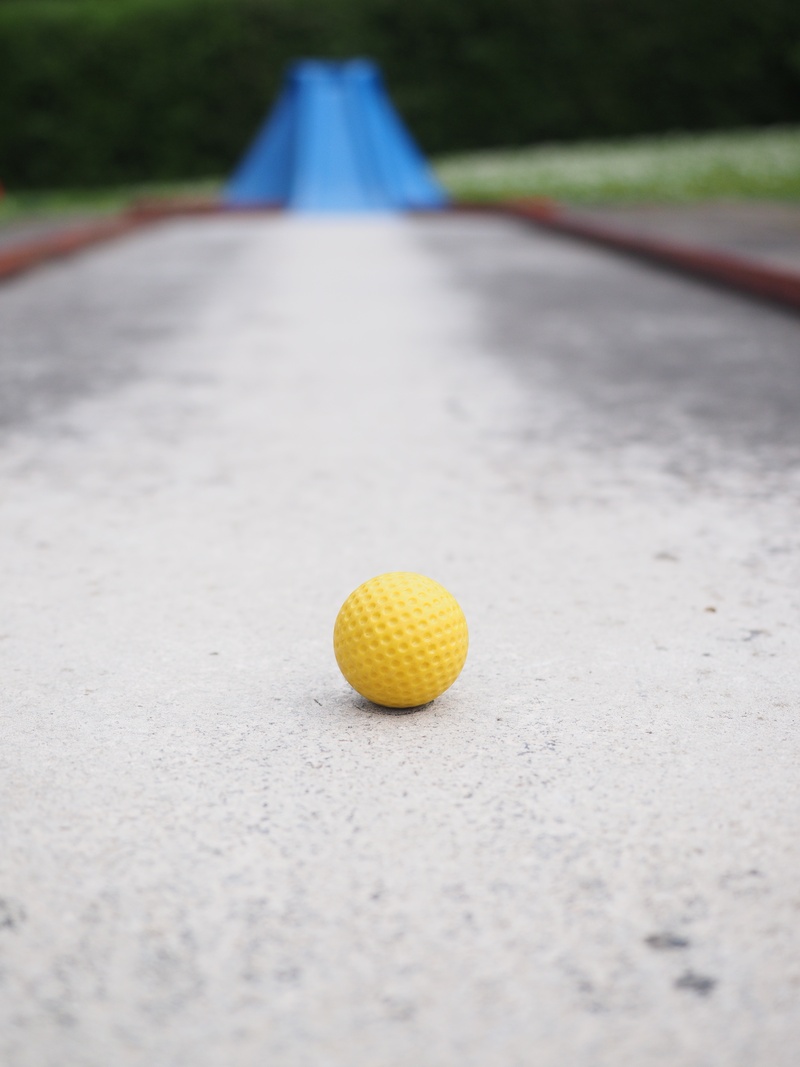 close-up, minigolf ground, concrete, train, miniature golf, selective focus, obstacles, day, nature, eternit track, 4K, land, mini golf ball, outdoors