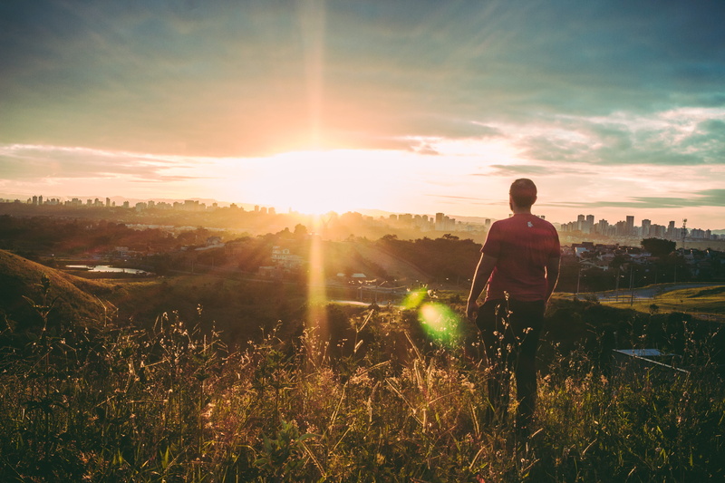 bright, sunset, cloud - sky, field, lifestyles, landscape, land, sunlight, rear view, person, travel, light, dawn, grass, man, back view, leisure activity