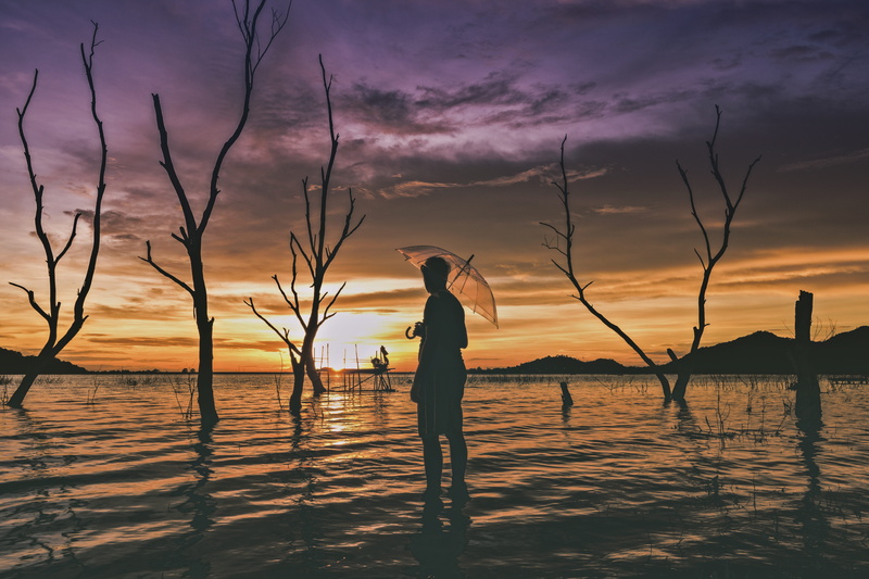 standing, trees, one person, sun, scene, lifestyles, beach, cloud - sky, leisure activity, real people, evening, clouds, dusk, waiting, sunset, tranquil scene