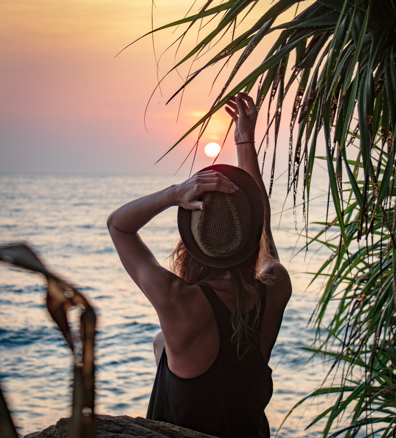 horizon over water, sun hat, sky, leisure activity, clothing, outdoors, women, nature, hairstyle, one person, racerback, beauty in nature, lifestyles, beach