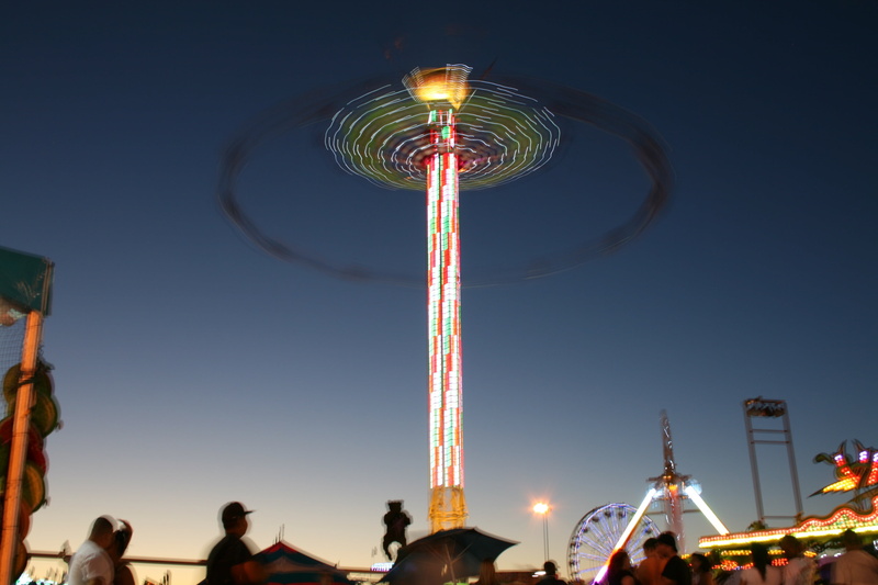 lights, amusement park ride, nature, clear sky, chain swing ride, ferris wheel, sky, fun, infrastructure, celebration, night, dark, low angle view, illuminated