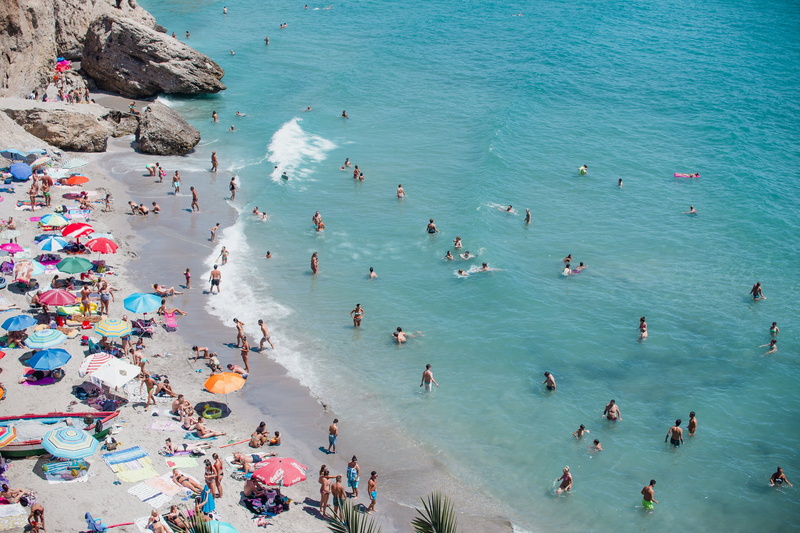 waves, family, ocean, blue, crowd, real people, rock - object, sea, leisure activity, high angle view, lifestyles, summer, sand, trip, daytime, land, vacations