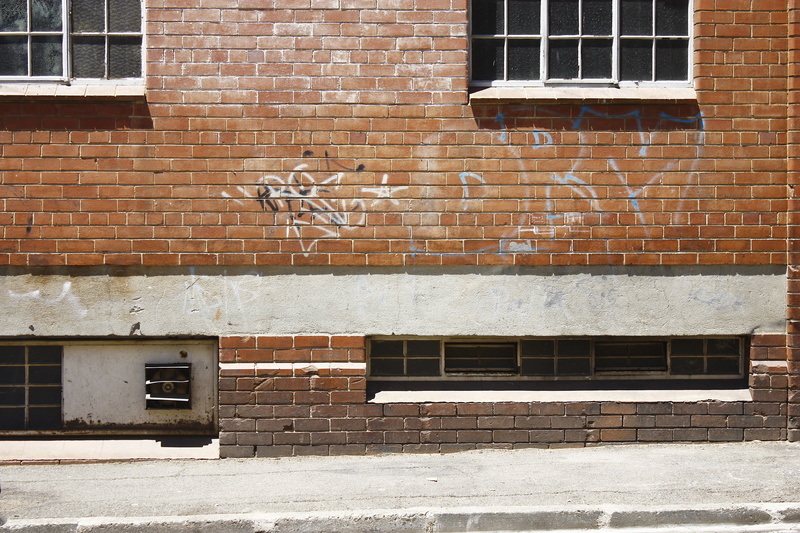 sidewalk, building, brick, facade, brickwall, footpath, no people, brick wall, apartment, built structure, day, wall, communication, outdoors, old, architecture