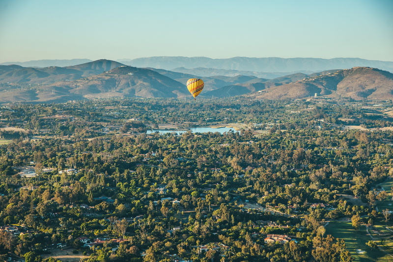 day, hill, transportation, tree, photo, mountain, air Vehicle, travel, outdoors, 5K, yellow, hot Air Balloon, no people, landscape, flying, environment
