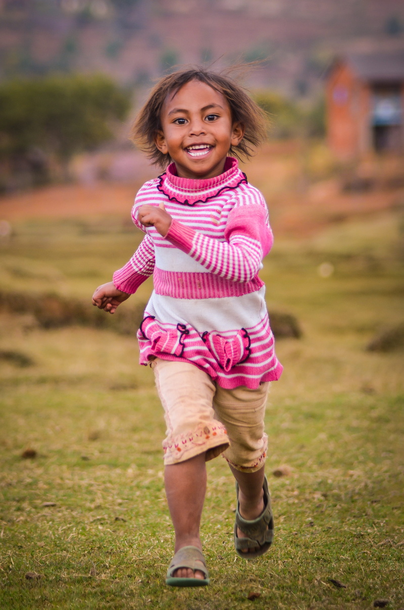 jumping, childhood, nature, poor girl, girls, girl, one person, women, fun, grass, poor country, playing, poverty, looking at camera, smile, 4K, outdoors