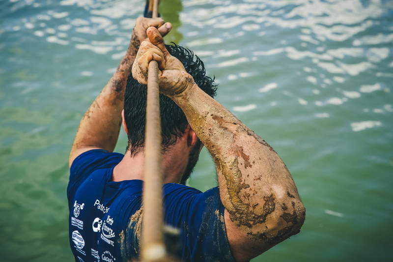 holding, leisure activity, adventure, men, bridge, real people, hand, catch of fish, rope, mud, day, 2K, man, water, male, daytime, adult, strong, person