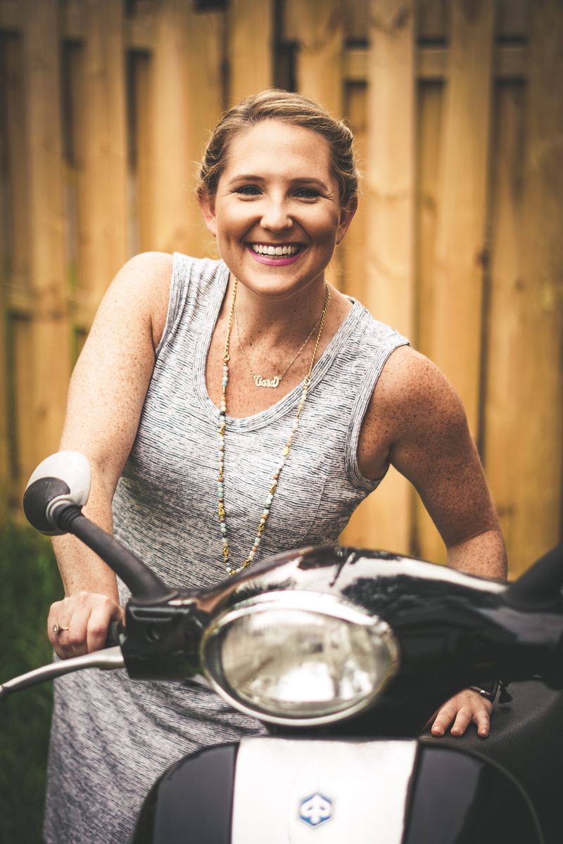 riding, emotion, joy, transportation, hairstyle, holding, cheerful, focus on foreground, three quarter length, people, looking at camera, smiling, lady