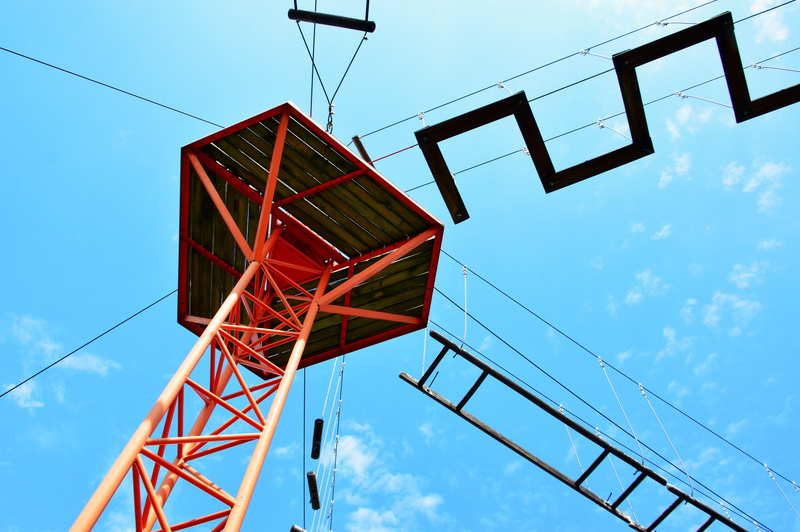 blue, no people, sky, high in, power line, entertainment, cloud, skill, lighting equipment, adventure park, ropes course, built structure, low angle view