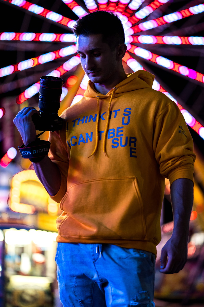 lumix, sony a7iii, man, holding, lifestyles, dslr, three quarter length, crowd, lighting, panasonic gang, royalzproduction, panasonic gh5, front view, arcade game machine