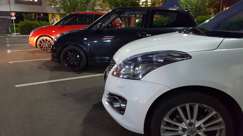 suzuki swift sport, headlight, road, transportation, retail, land vehicle, parking, misfortune, shopping, parking lot, vehicle hood, motor vehicle, front view