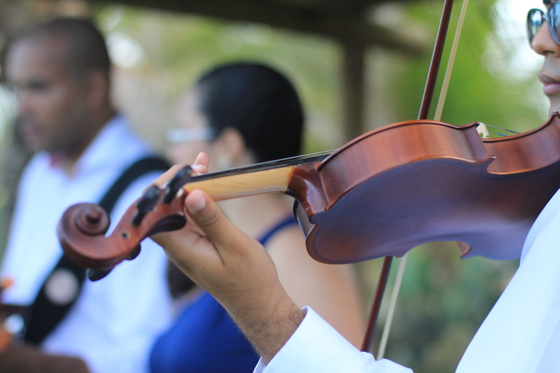people, playing, arts culture and entertainment, real people, classical music, event, focus on foreground, finger, holding, musical equipment, two people