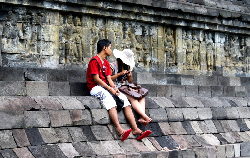 historical, couple - relationship, budha, sitting, indonesian, young men, heritage, 2K, women, positive emotion, people, architecture, lifestyles, stone foundation