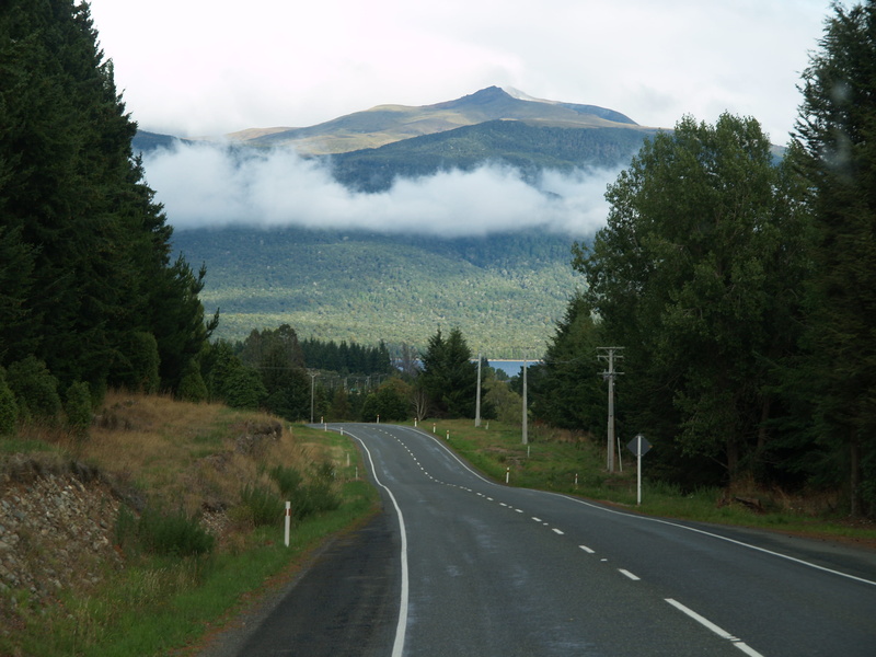 sky, dividing line, no people, symbol, cloud - sky, tree, outdoors, remarkables, road, plant, tranquility, road marking, diminishing perspective, mountain
