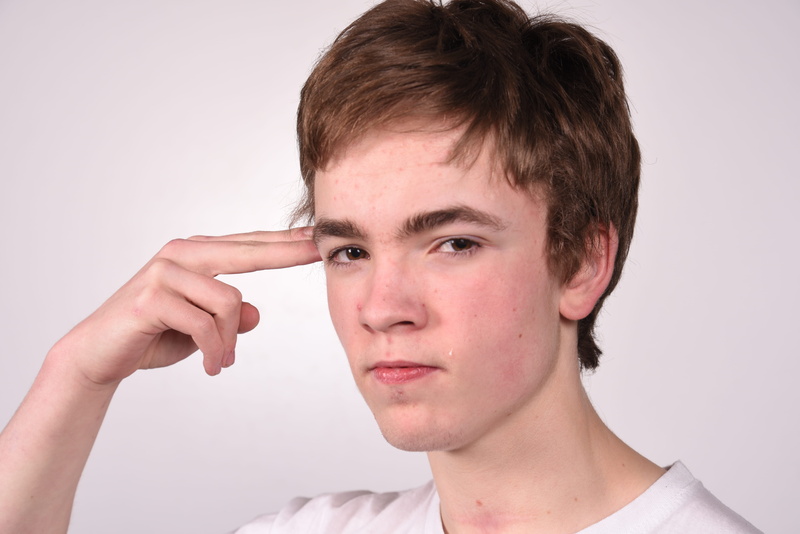 gun, closeup, nose, face, focal, uncertainty, finger gun, brunette, deaf, brown hair, body part, brown, studio shot, front view, contemplation, portrait