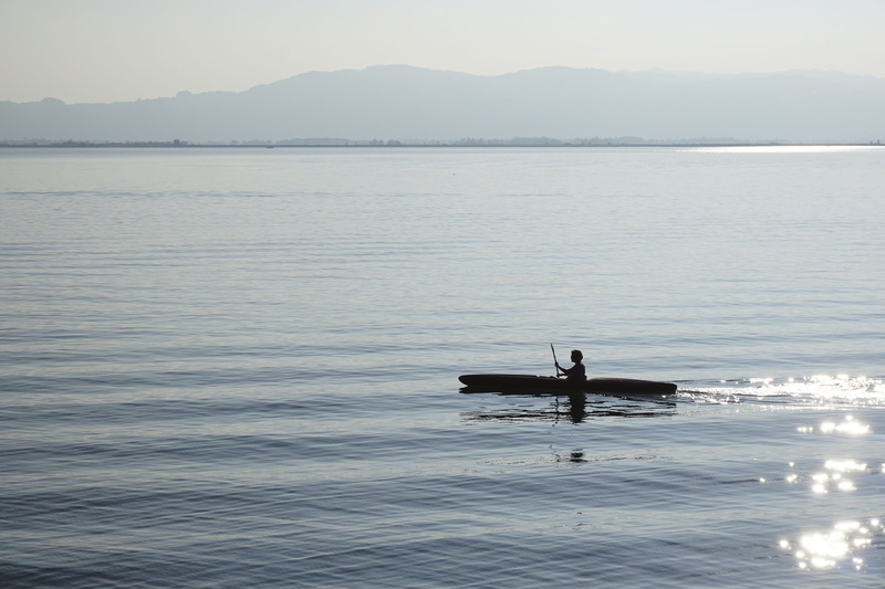 silhouette, lake, tranquility, glitter, canoeist, transportation, one person, nature, day, nautical vessel, canoeing, men, sea, boot, real people, holiday