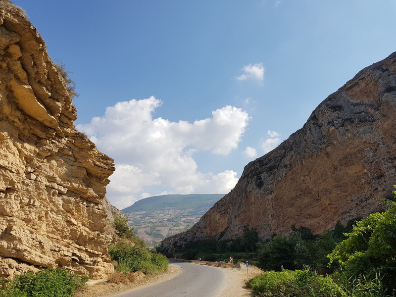 plant, outdoors, 4K, mountain range, day, mountain, non-urban scene, no people, the way forward, rock - object, road, cloud - sky, solid, diminishing perspective