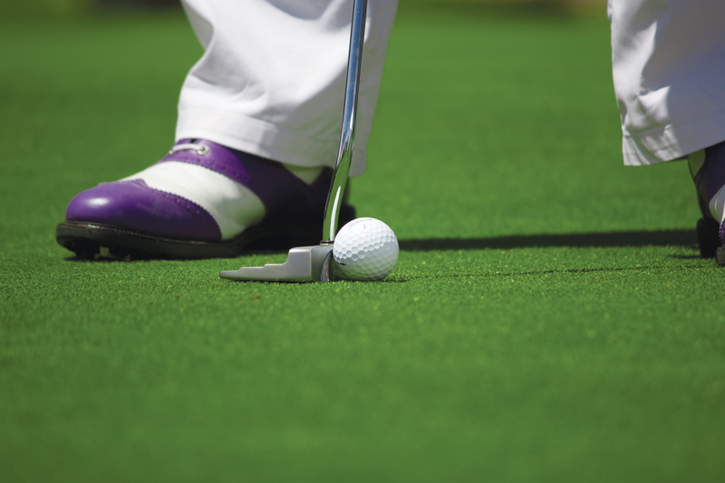 playing, low section, human limb, club, golf course, putting green, body part, shoes, outdoors, golf club, sport, competition, putting, weekend activities