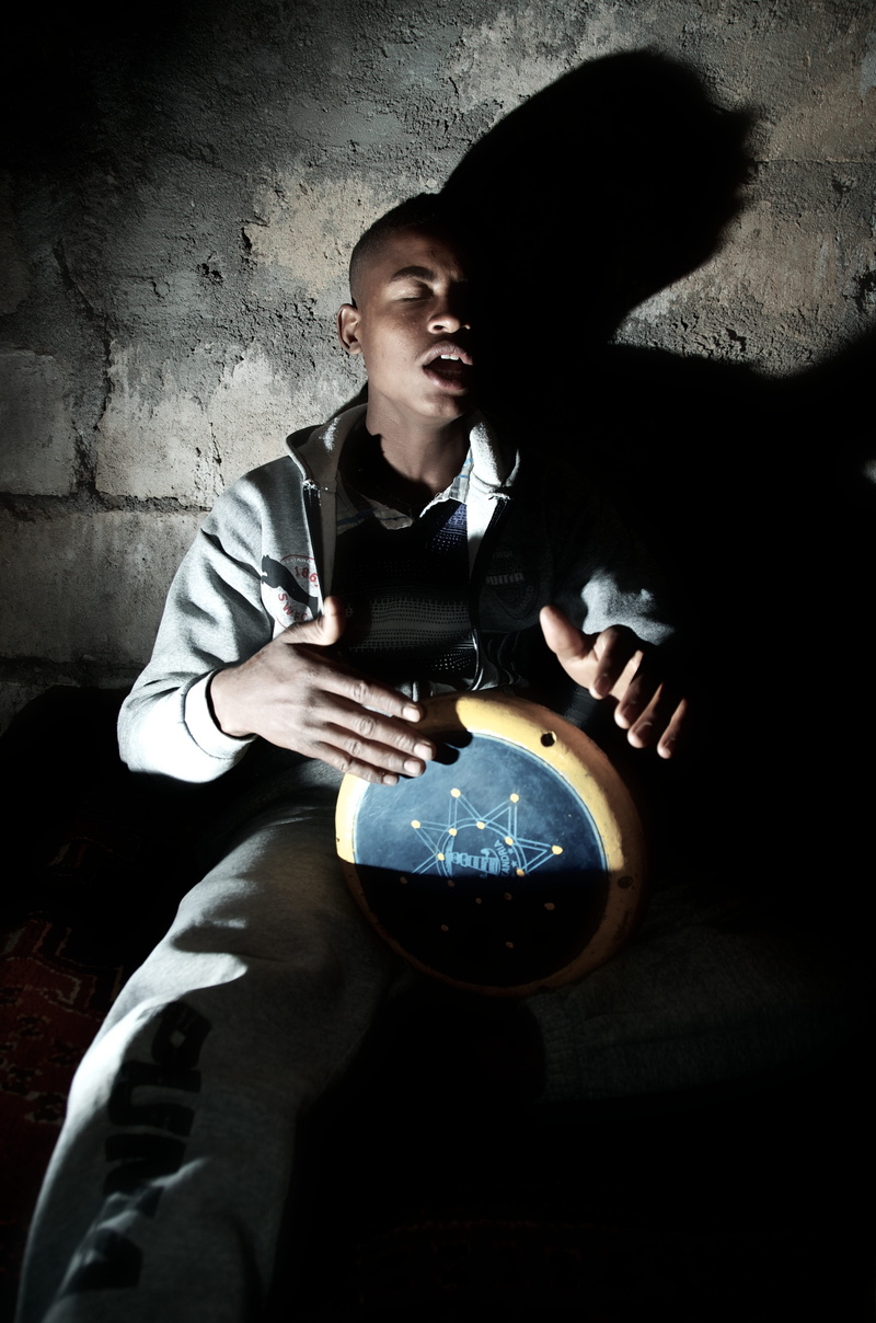 males, futuristic, people, holding, three quarter length, crystal ball, musician, black, 4K, gray, sphere, sitting, drummer, young, teenager, indoors