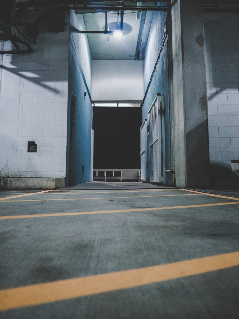 indoors, ocean city by night, ceiling, architectural column, road marking, public transportation, illuminated, 4K, flooring, no people, sign, parking lot