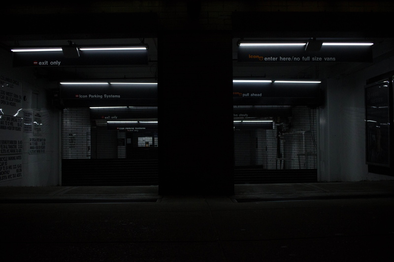 parking lot, gray, built structure, ceiling, illuminated, transportation, fluorescent light, gate, subway station, communication, city, dark, garage, empty