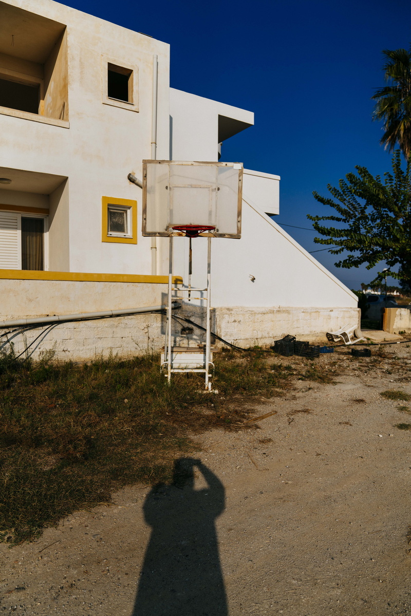  clear sky, person, residential district, architecture, real people, house, blue sky, building, fir, road, basket, plant, banister, building exterior