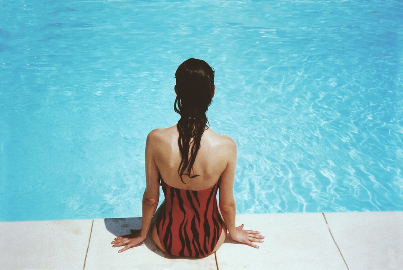 leisure, three quarter length, swimwear, one person, swim, summer, girl, outdoors, water, blue, adult, hairstyle, women, sunlight, lifestyles, young adult